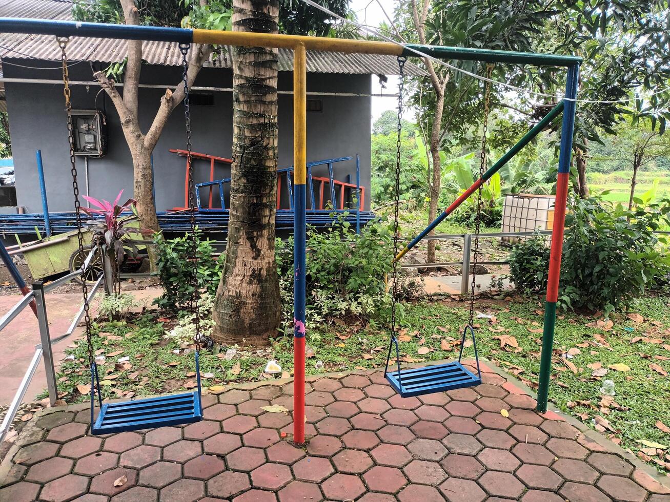 Empty Colorful Swings in a Playground Setting photo