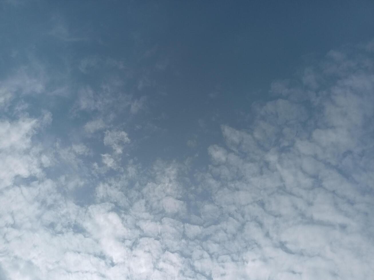 Delicate clouds in open sky photo