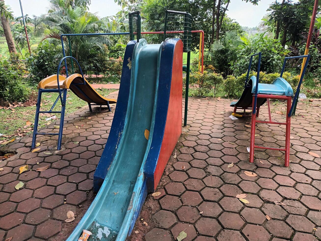 Empty Colorful Slides in an Outdoor Playground photo