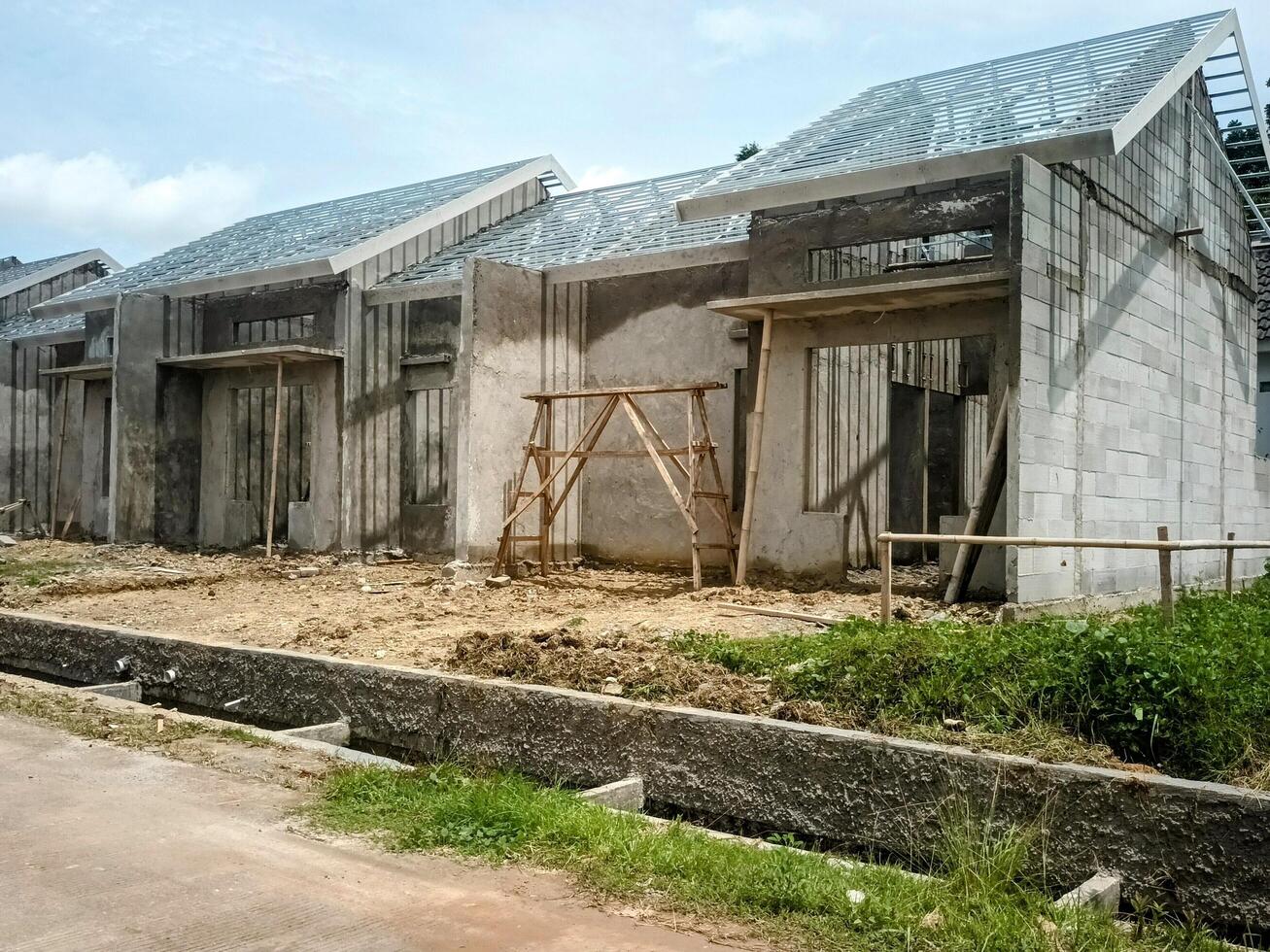 Construction Site of Row Houses under a Cloudy Sky photo