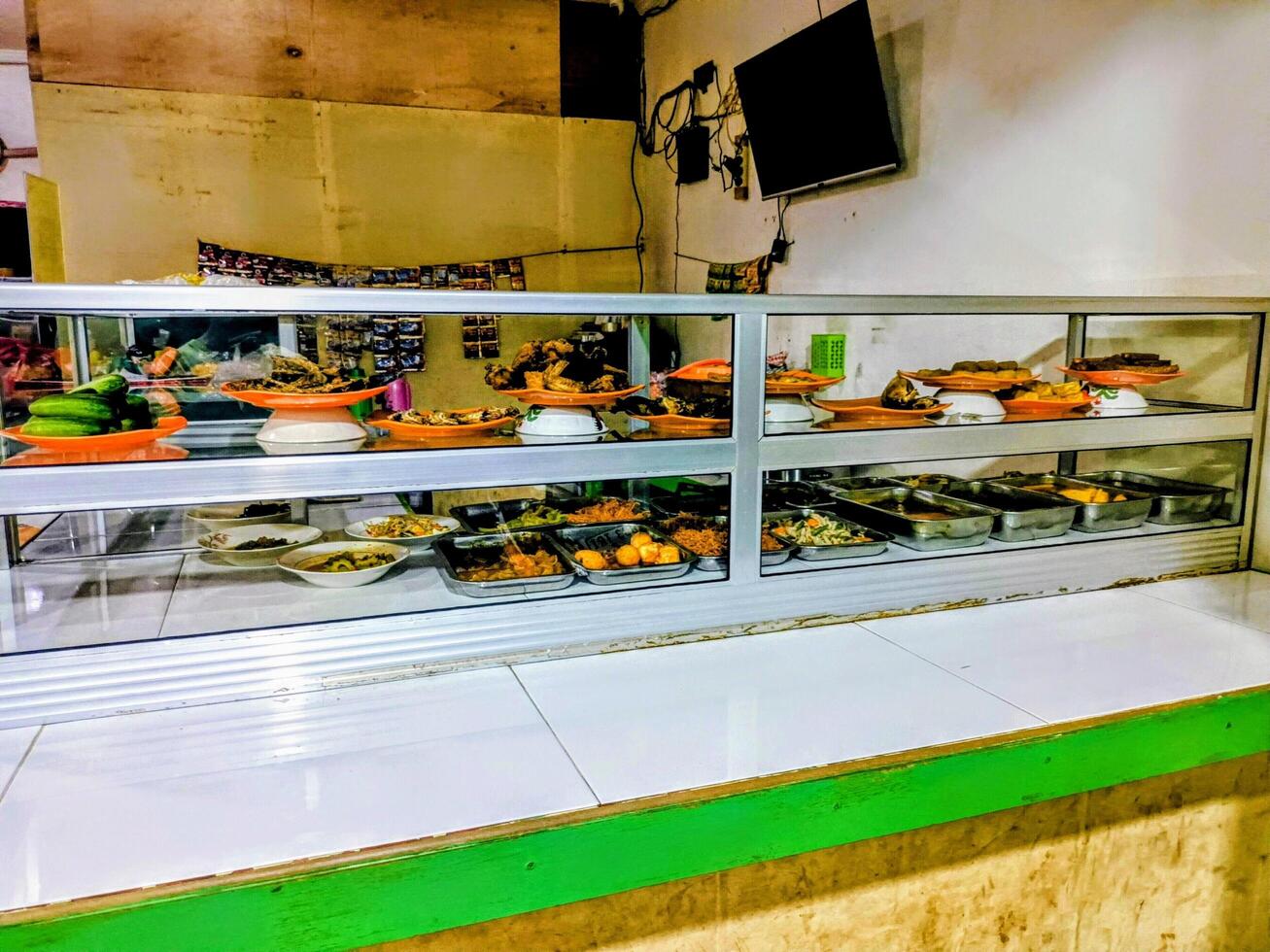Display Case of Various Indonesian Dishes photo