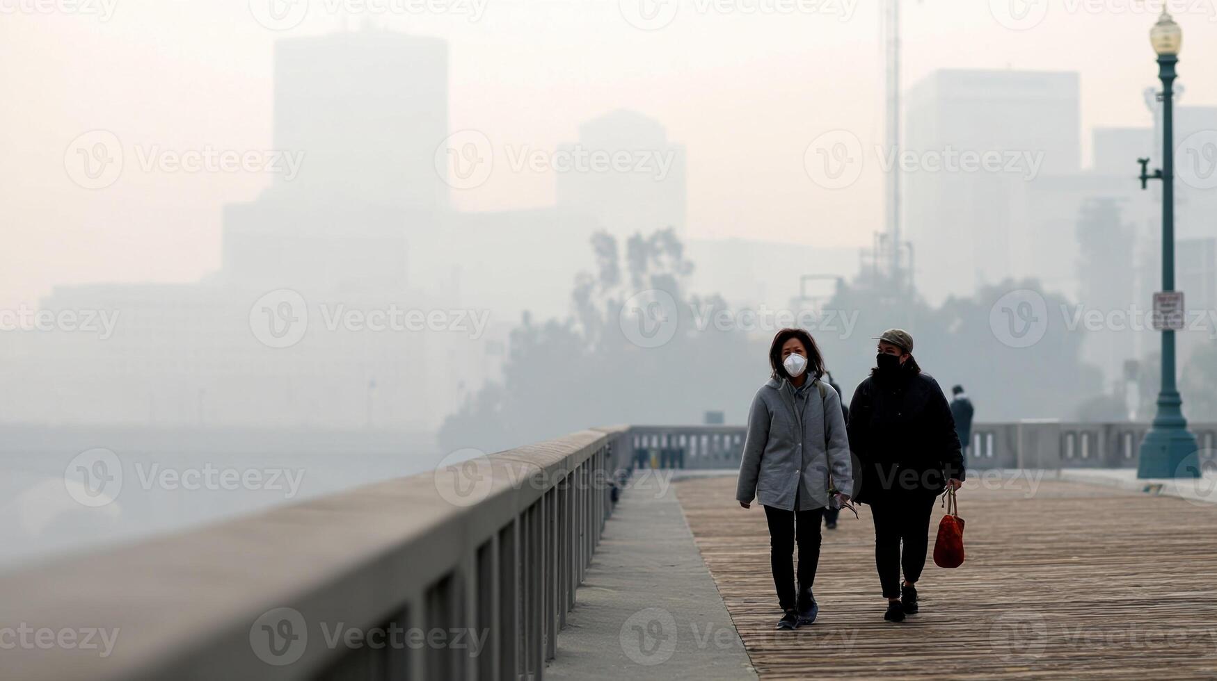 A city skyline shrouded in thick smog with pedestrians wearing masks and visibility greatly reduced reflecting air pollution linked to climate change photo