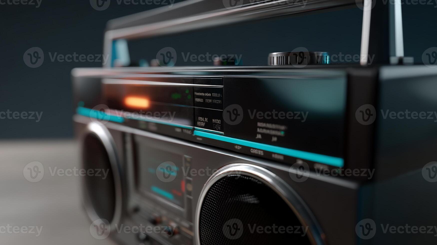 Close-up of a vintage boombox, showing controls and display. Features a dark gray chassis, turquoise accents, and a glowing indicator photo