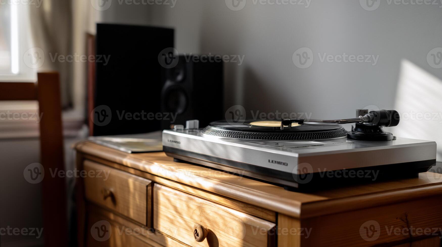 Turntable on wooden cabinet, speakers in background, sunlight photo