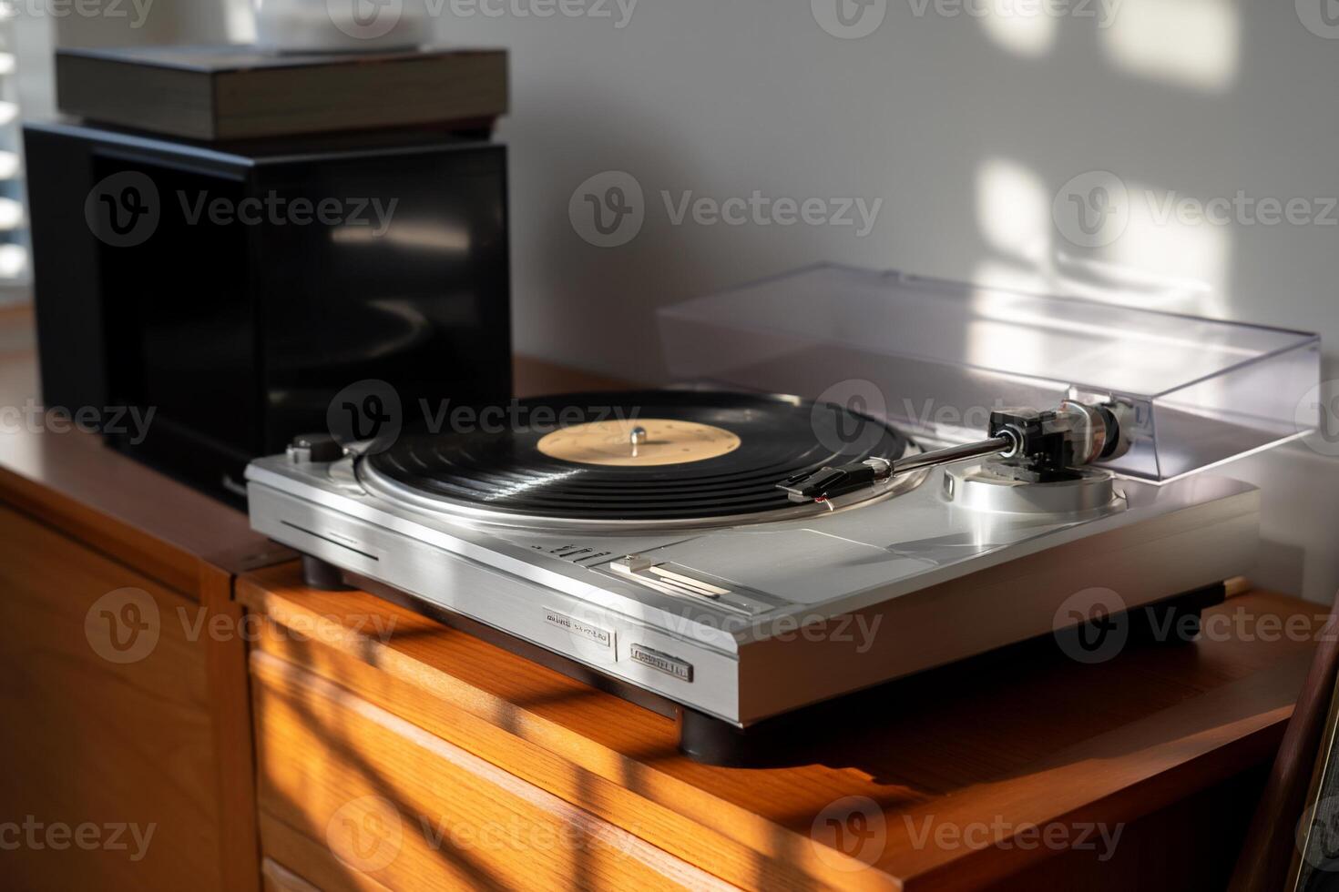 A turntable sitting on a wooden table photo