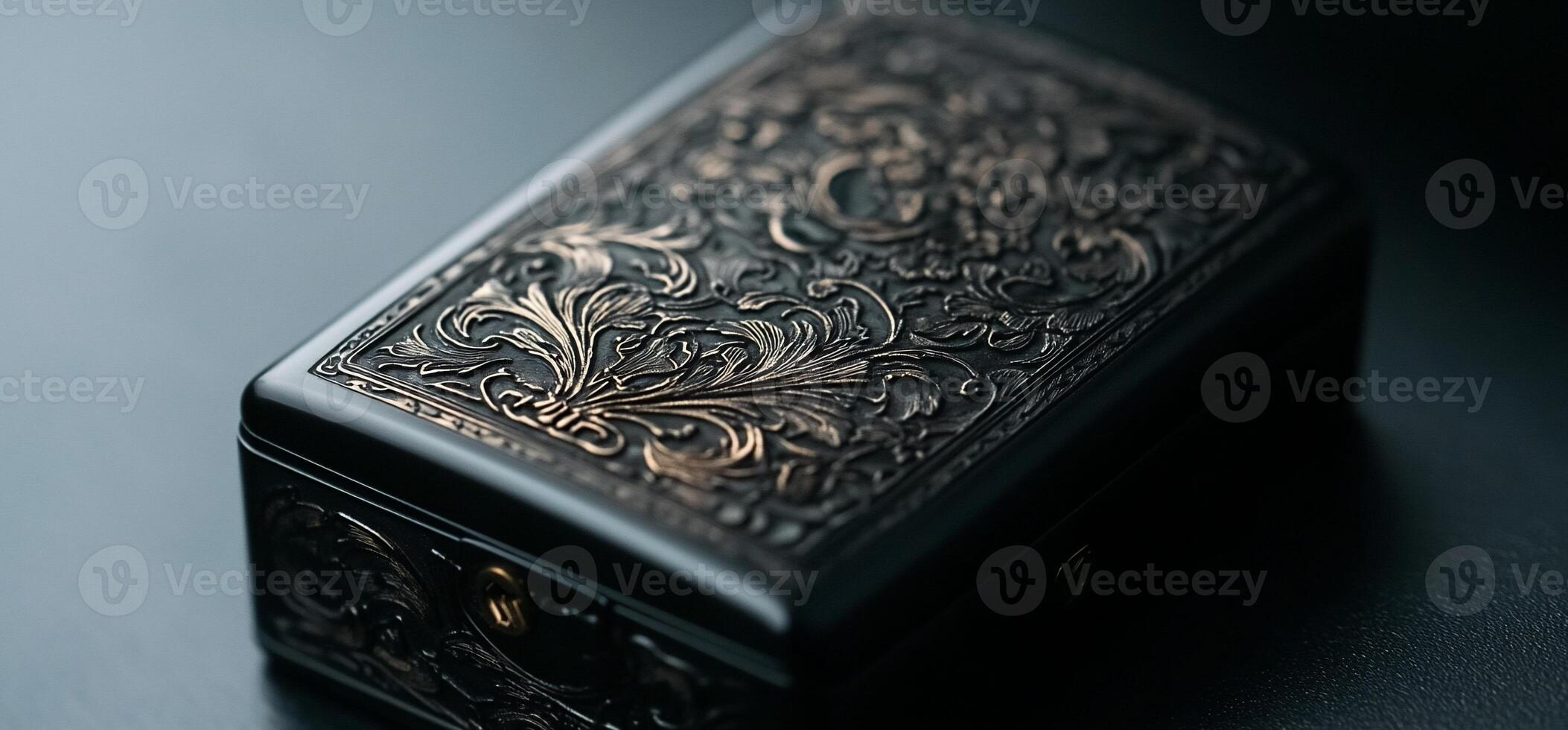 Ornate black box with intricate gold filigree design photo