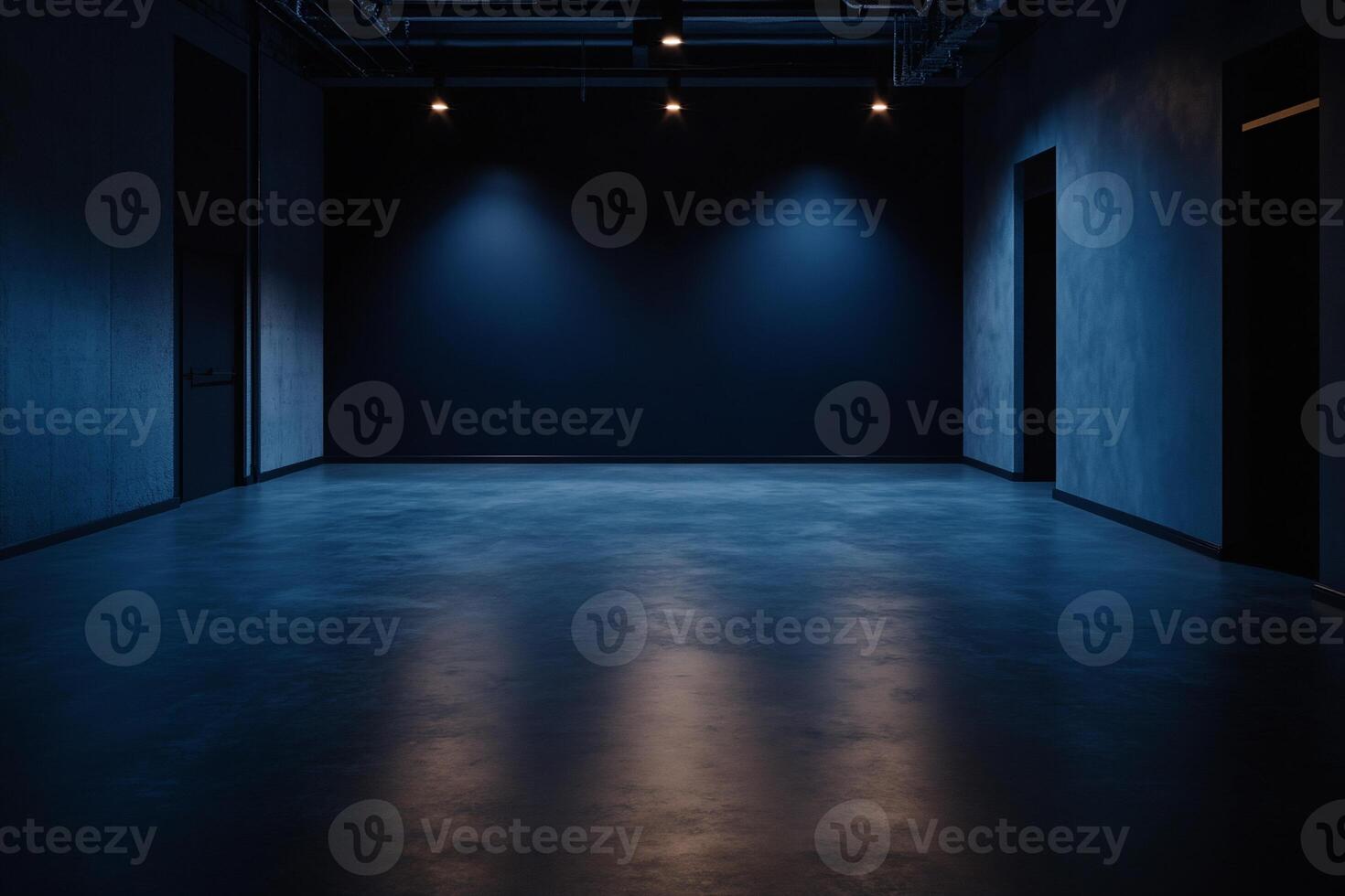 Empty, dark room with blue spotlights. Concrete walls and floor photo