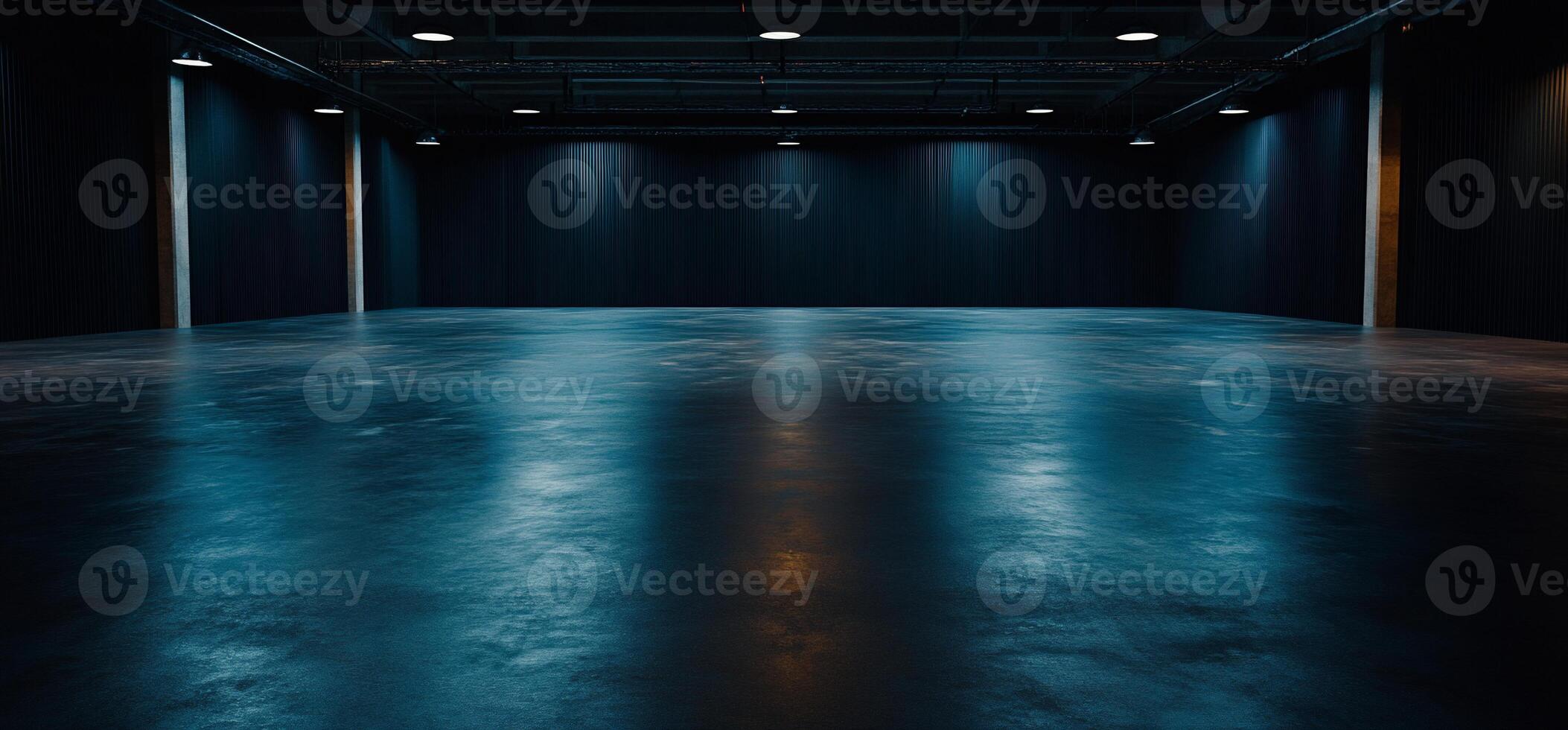 Empty room with dark lighting and concrete floor photo