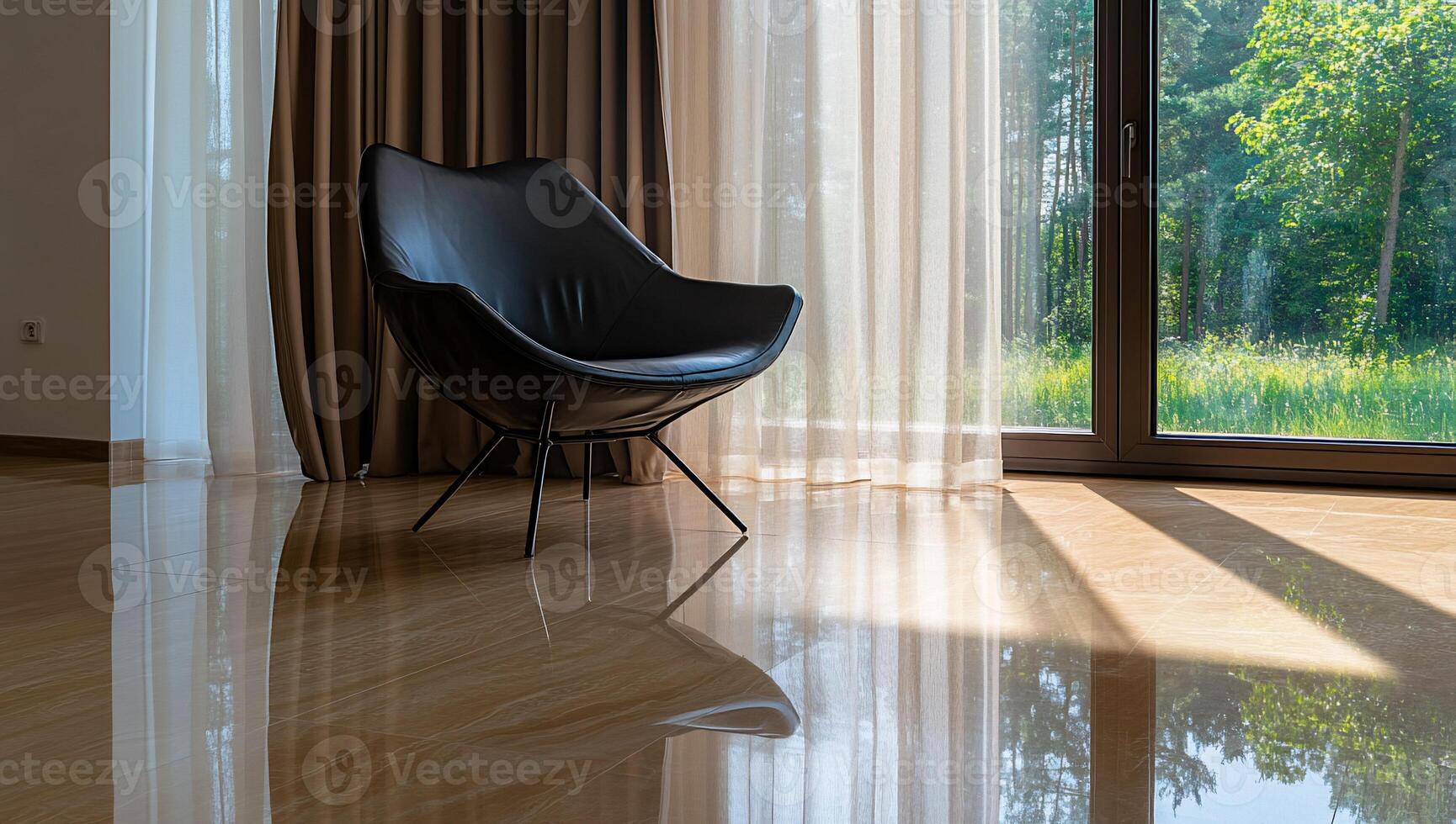Modern black chair in sunlit room with polished floor and view photo