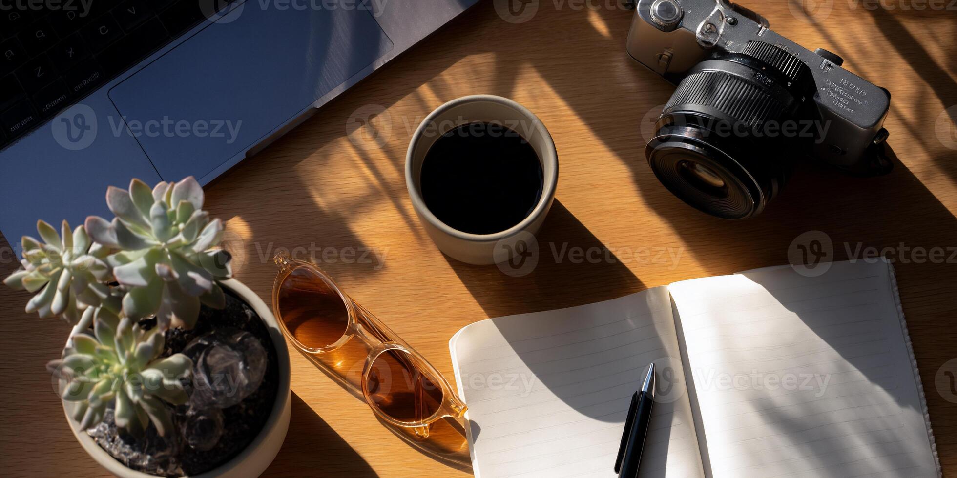 Laptop, coffee, camera, succulents, notebook, sunglasses photo