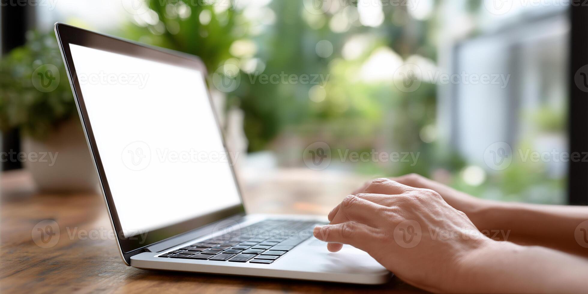 Laptop computer use. Hands typing on keyboard photo