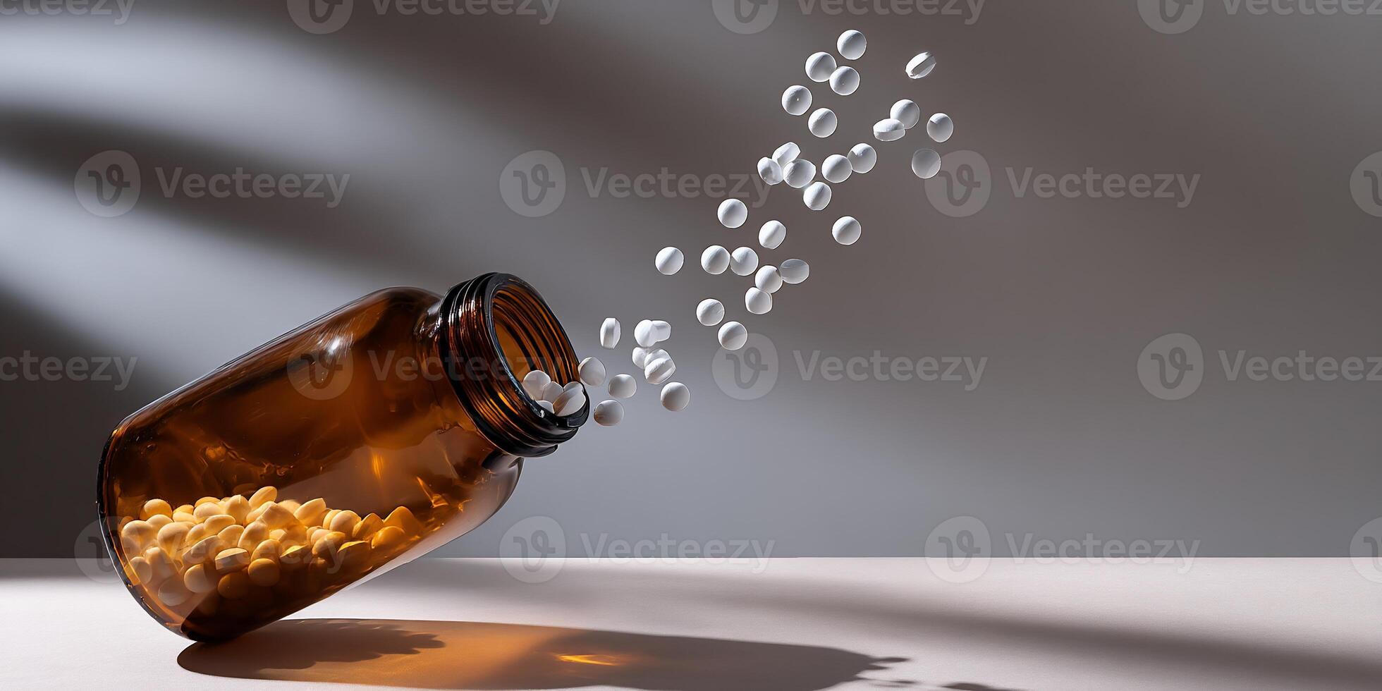 A bottle filled with pills falling out of it photo