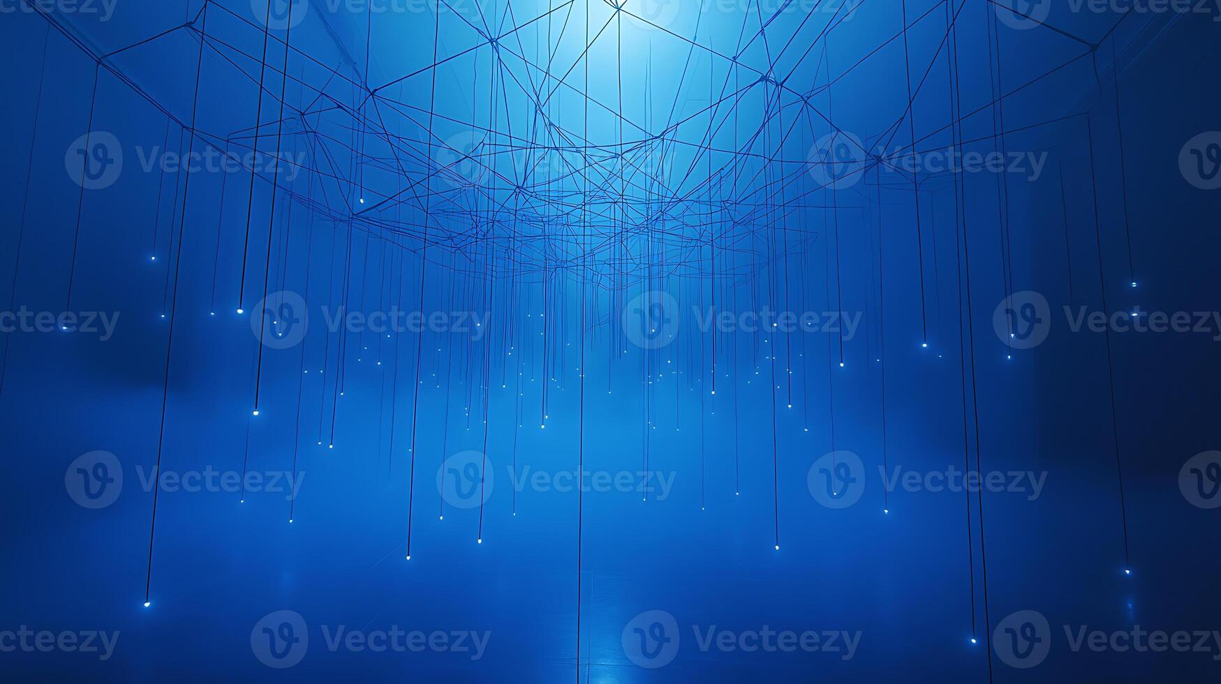A blue room with strings hanging from the ceiling photo