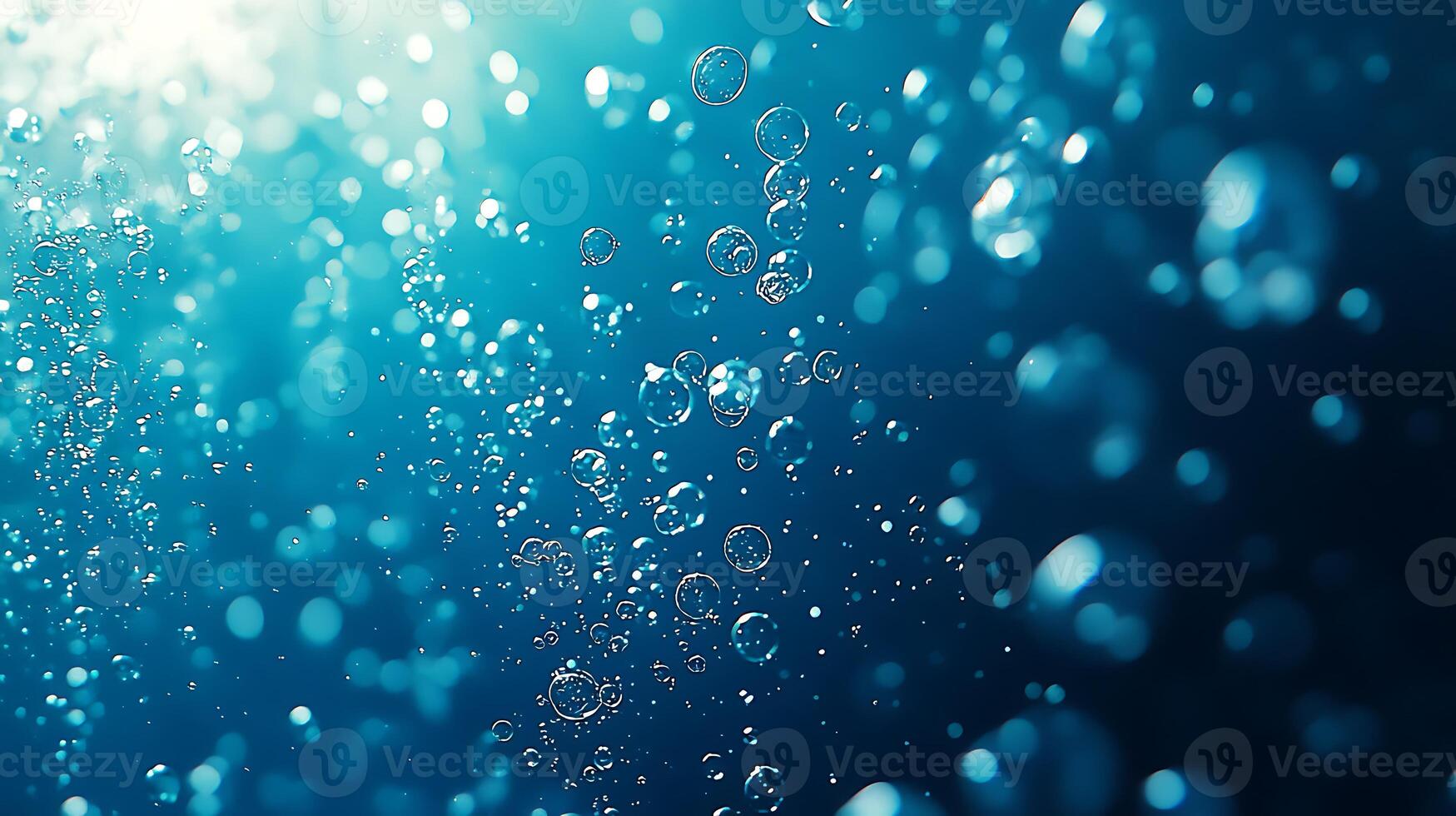 Bubbles in the water with sunlight shining through photo