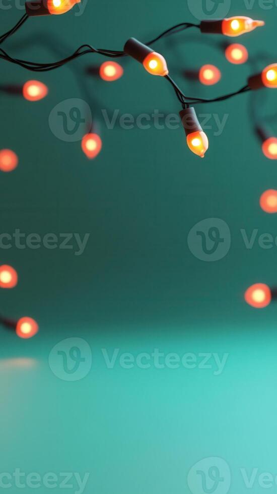 Warm light bulbs hanging against a green backdrop, evoking holiday festive a atmosphere. Abstract background photo