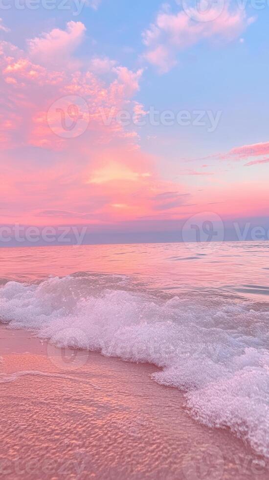 water pastel pink sunset reflecting on calm ocean Soft with gentle wave washing ashore. Abstract background photo