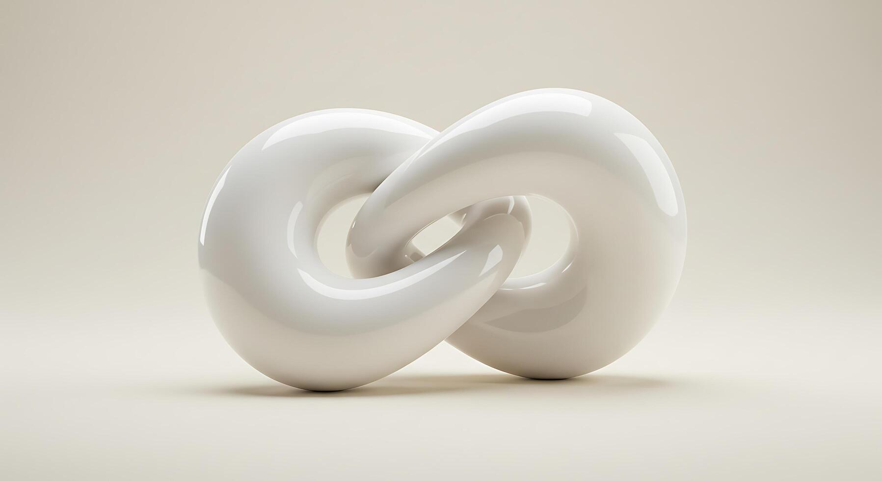 A white sculpture of two intertwined shapes photo