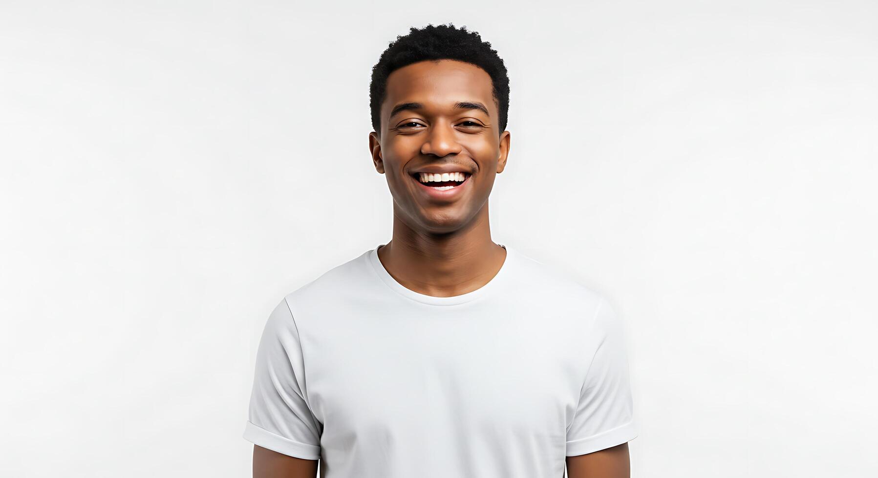 A smiling young man in a white t - shirt photo
