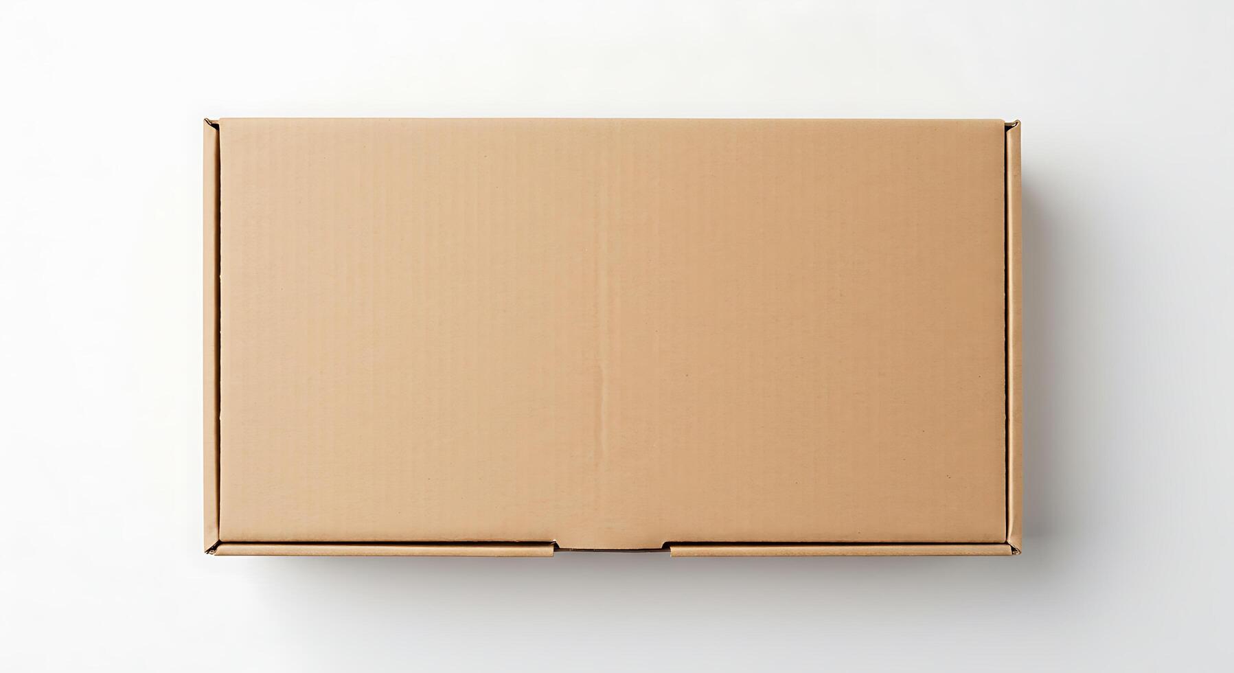 An empty cardboard box on a white surface photo