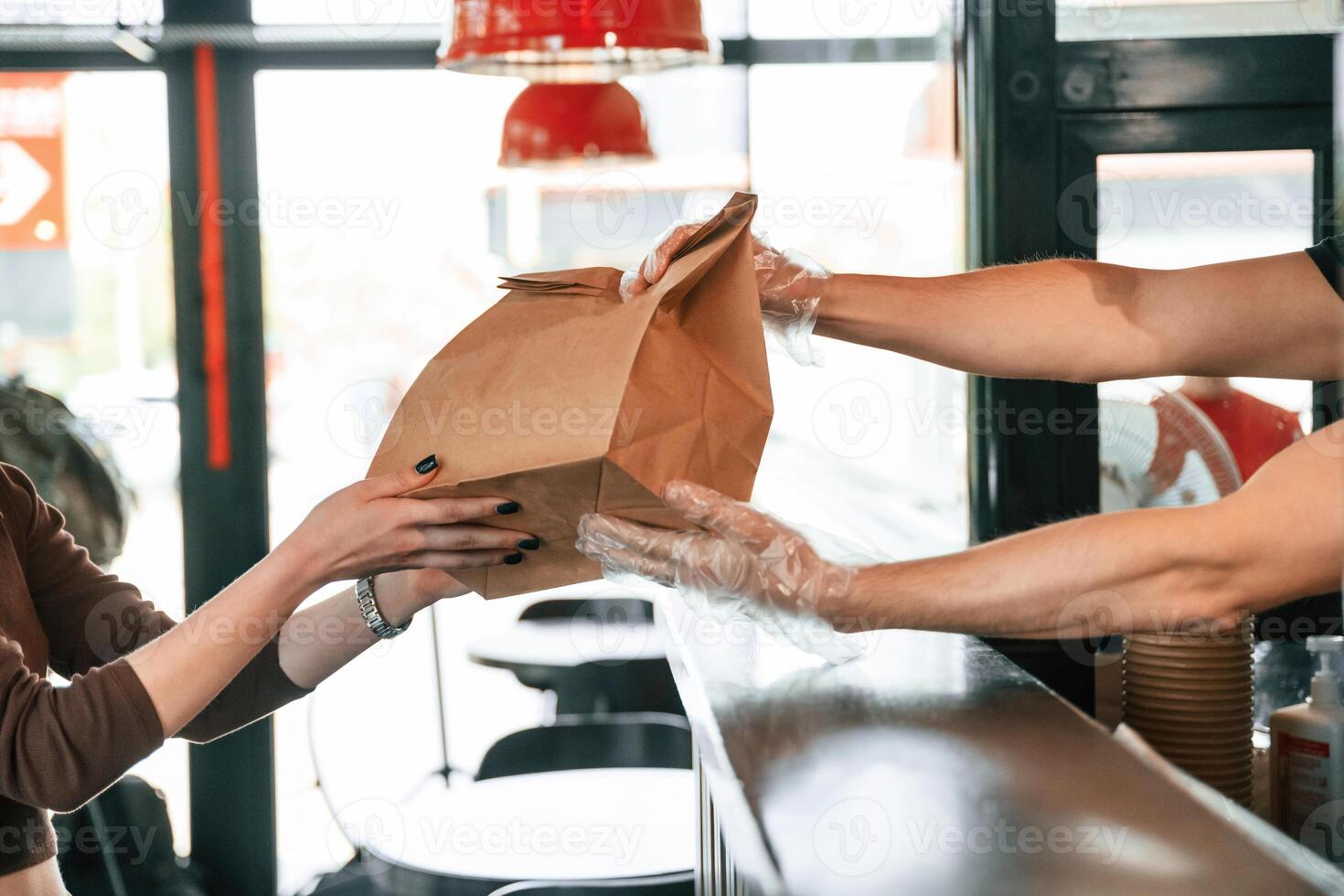 Giving the order to customer. Man is,,, serving delicious street food photo