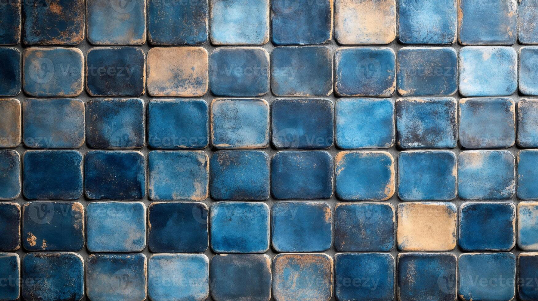 Blue and gold rustic ceramic tiles creating textured background photo