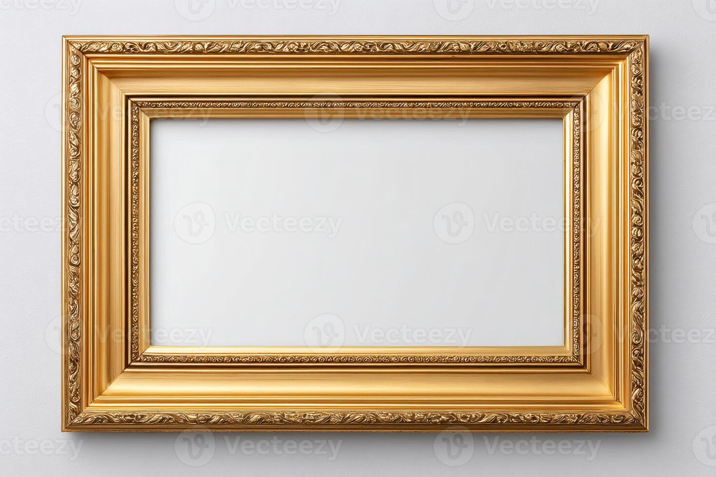 Golden ornate frame hanging on white wall, showing copy space photo