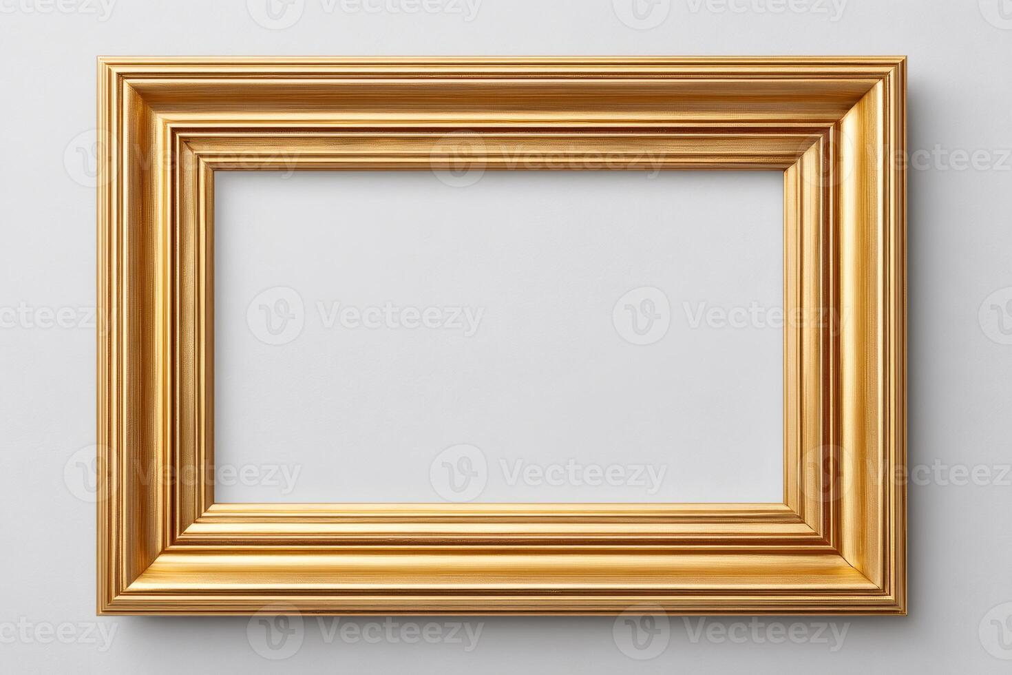 Golden frame hanging on white wall, offering space for artwork or photography photo