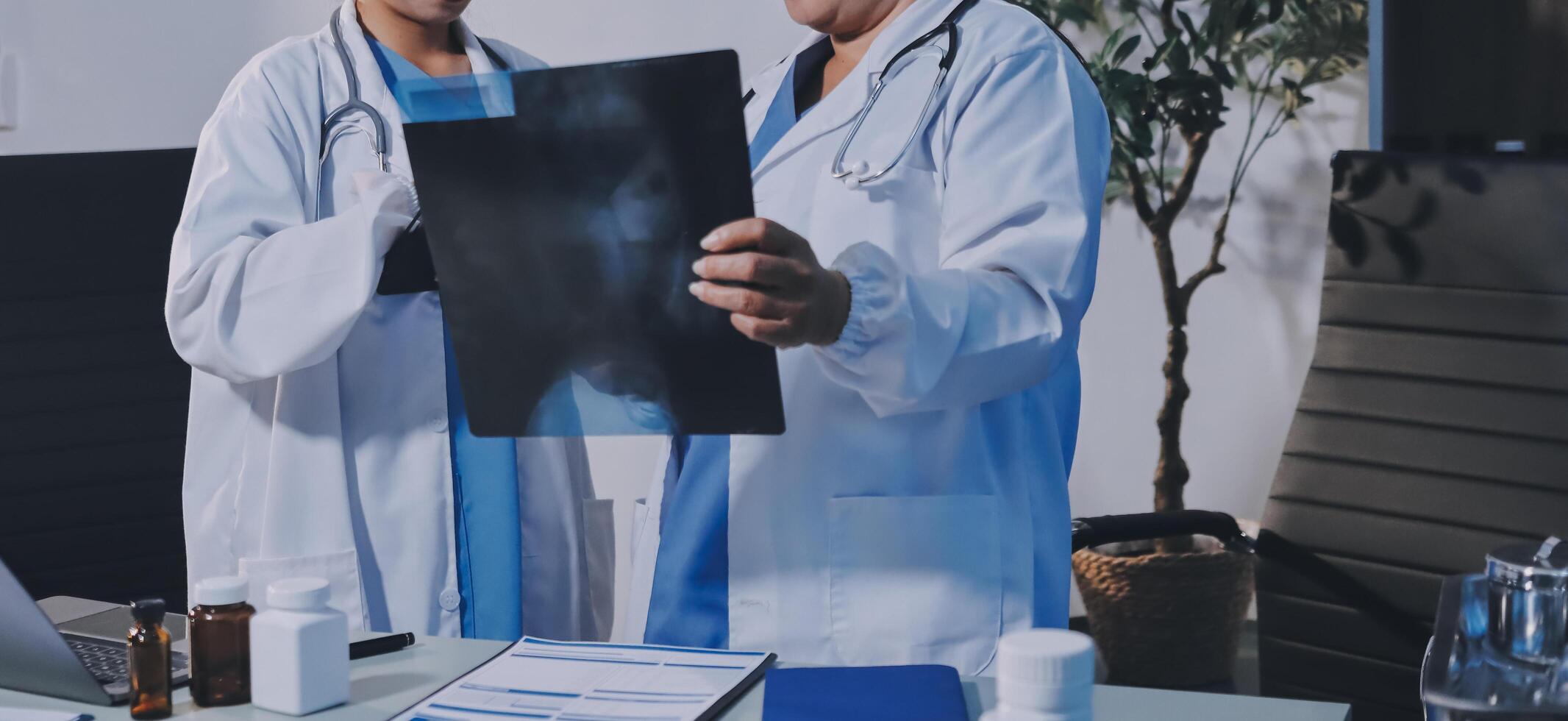 Two doctors looking at a black and white photo