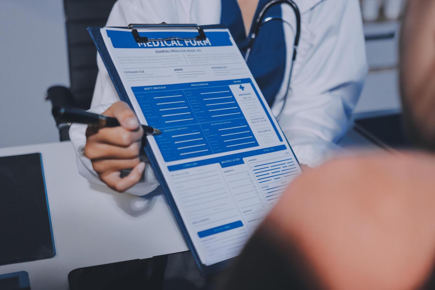 A doctor is holding a medical report in front of a patient photo