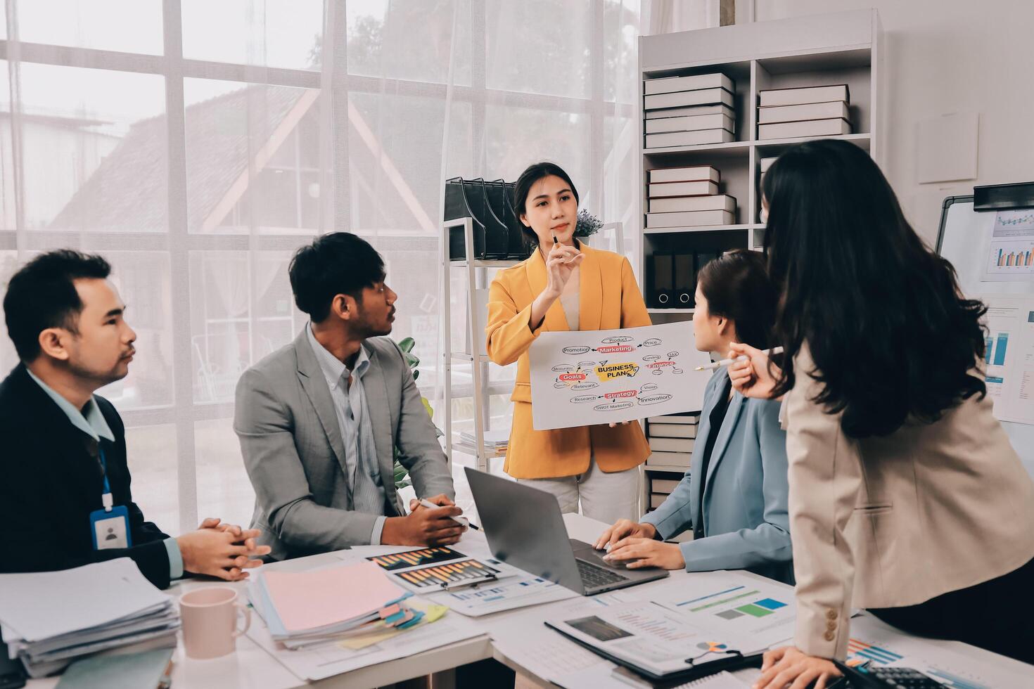 A group of people in an office meeting photo