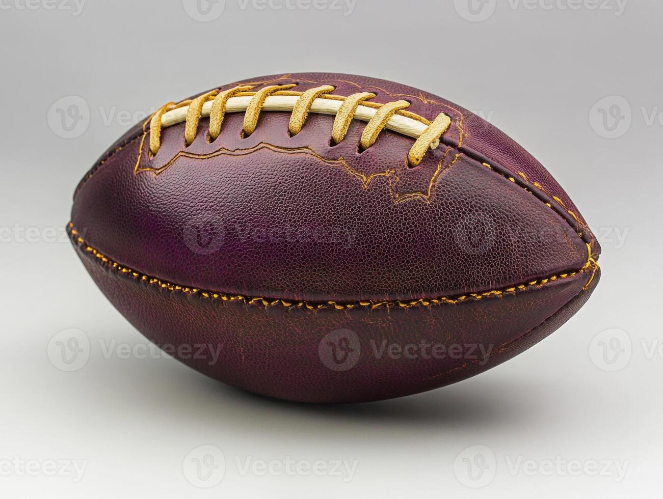Vintage leather football resting on a smooth surface photo
