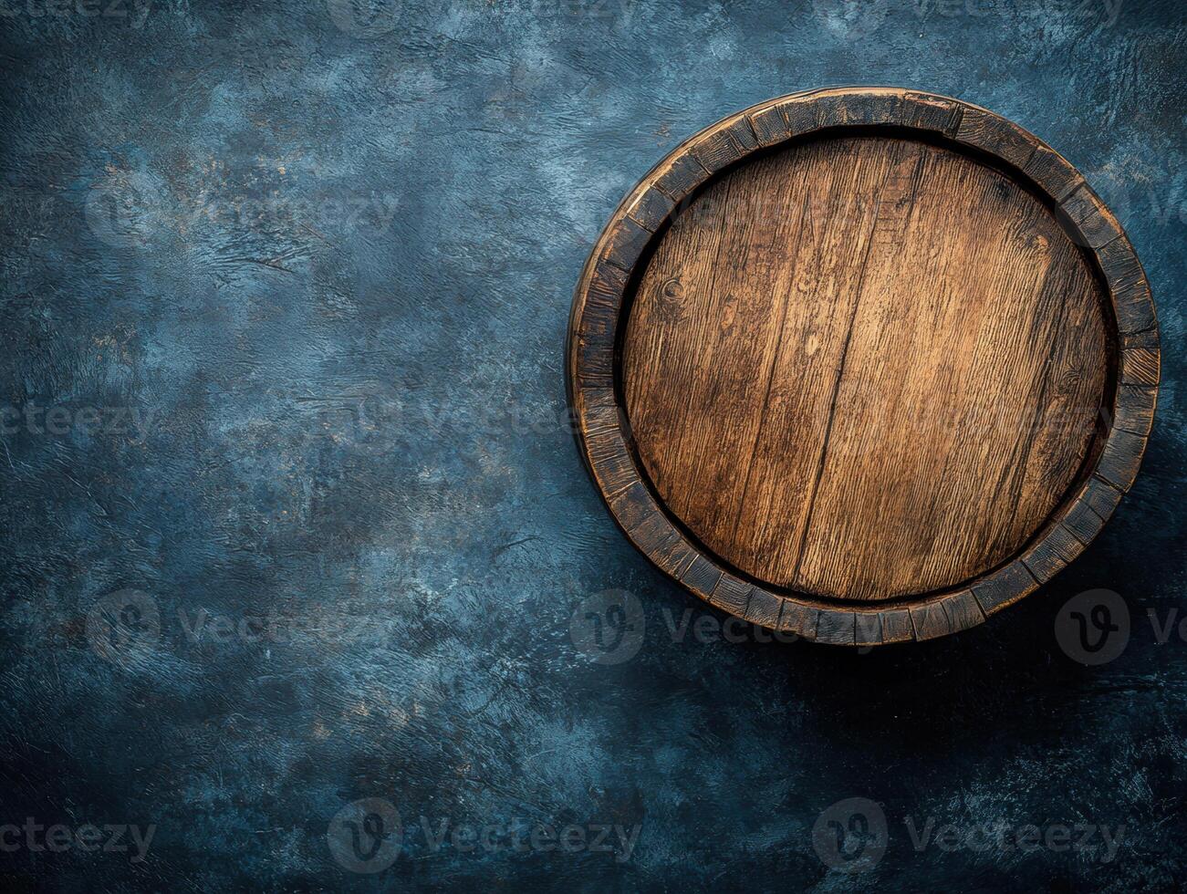 Wooden barrel on dark textured surface with a rustic charm photo