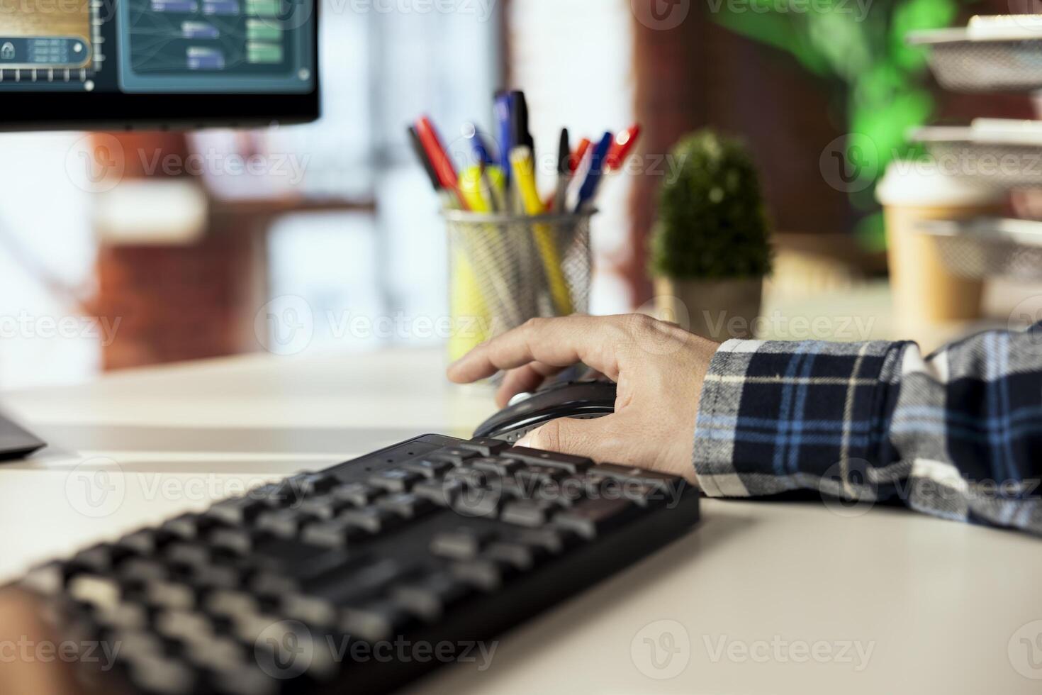 Man at home playing simulation videogame on PC, acting as interior designer remodeling room. Gamer having fun making home floor plans on immersive computer game, close up shot photo