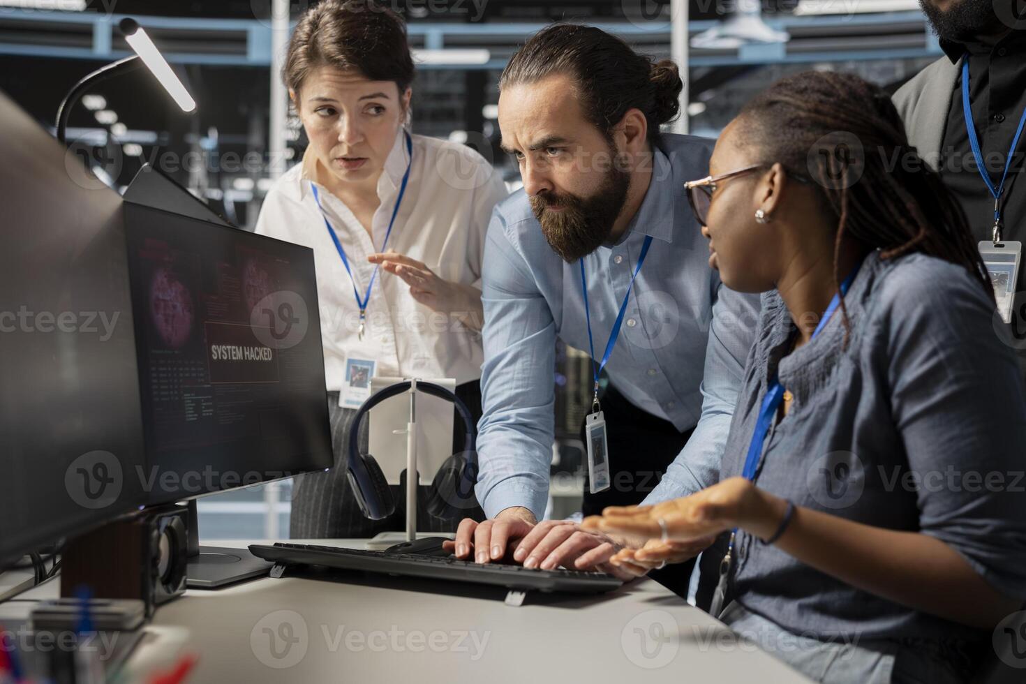 Worried computer scientists in data center reacting to virus alert, initiating protocol to protect systems. Server room staff members cooperating, assessing compromised gear after hacker attack photo