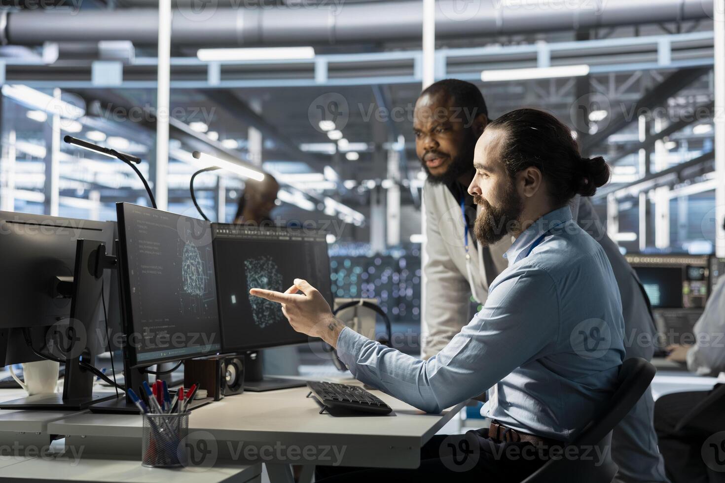 Team of programmers using computer in data center, integrating AI driven automation tools. Server farm IT experts working together, using artificial intelligence machine learning models photo