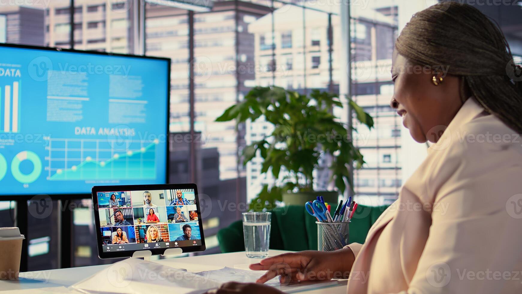 Skilled ambitious female CEO negotiating with shareholders on online conference, asking for funds to sustain an expansion project. Businesswoman director driven for success, leadership. Camera B. photo