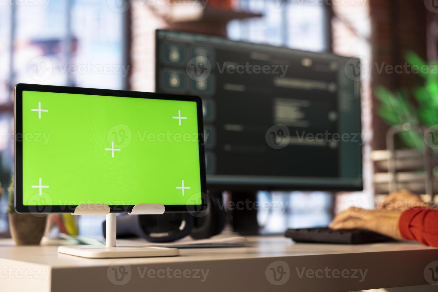 Freelancer typing prompts into AI chat interface on pc next to mockup screen, highlights the power of machine learning. Smart virtual assistant improves productivity and streamline communication. photo