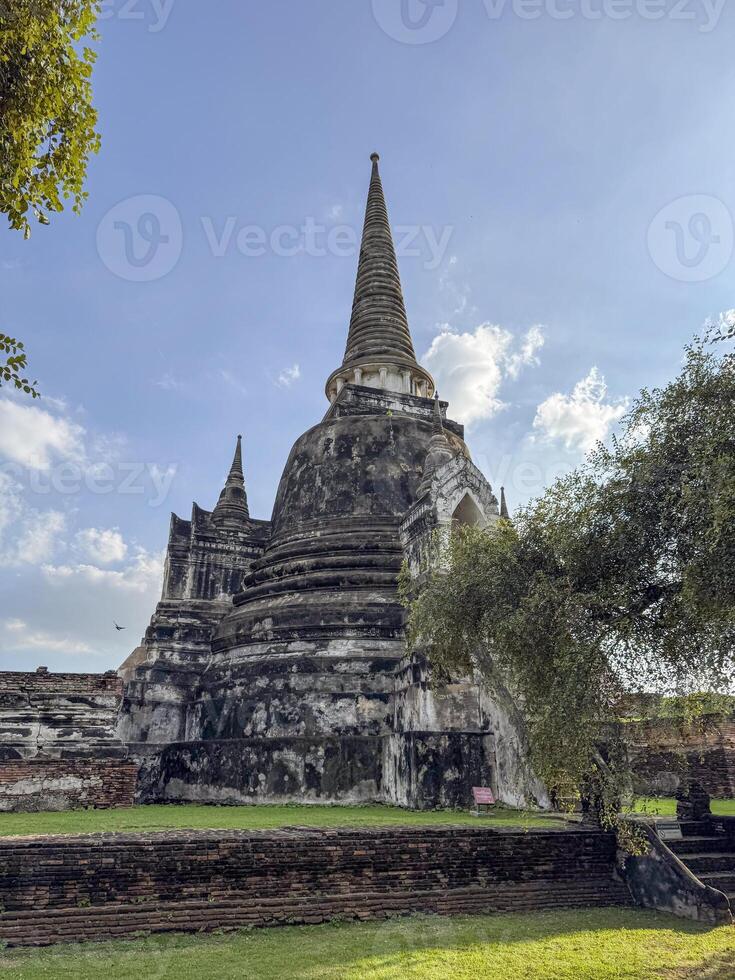 Ancient beautiful Wat Chaiwatthanaram Ayutthaya historic temple, brick towers glowing in the sunlight. Spiritual heritage, culture and architectural features for a sacred landmark. photo