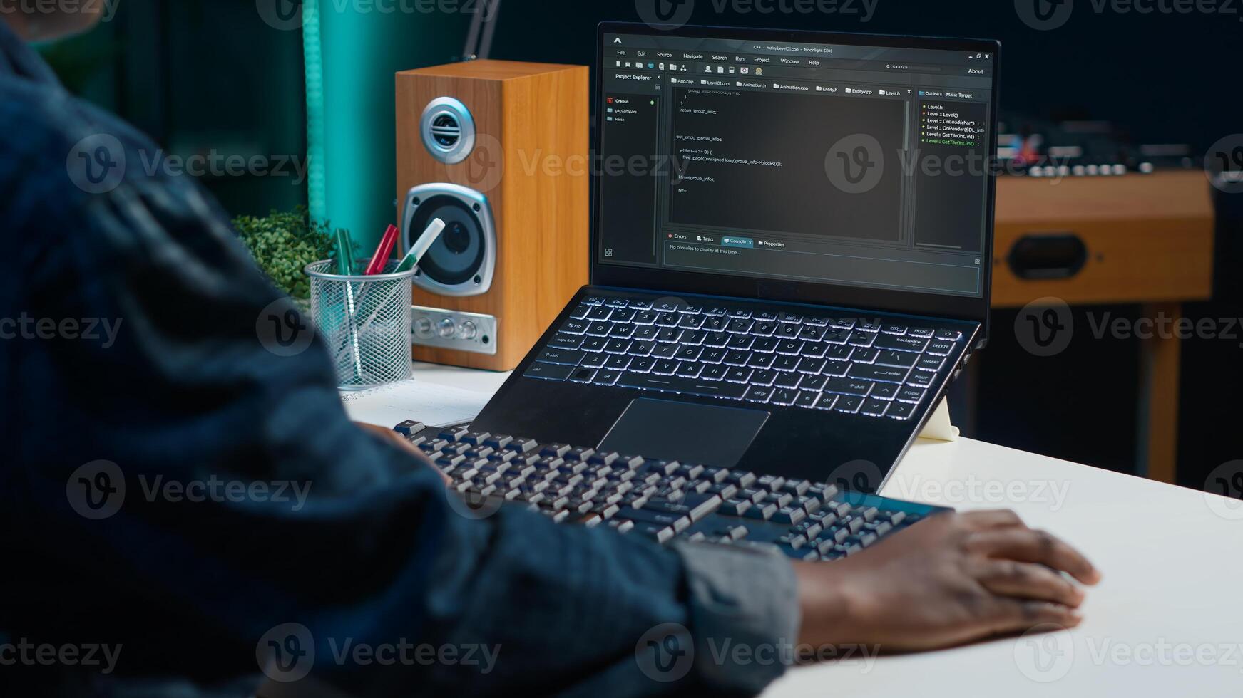 Teleworker in living room office using laptop to do coding for software developing, handheld camera shot. Remote employee typing on device keyboard, solving tasks in apartment, camera A close up photo