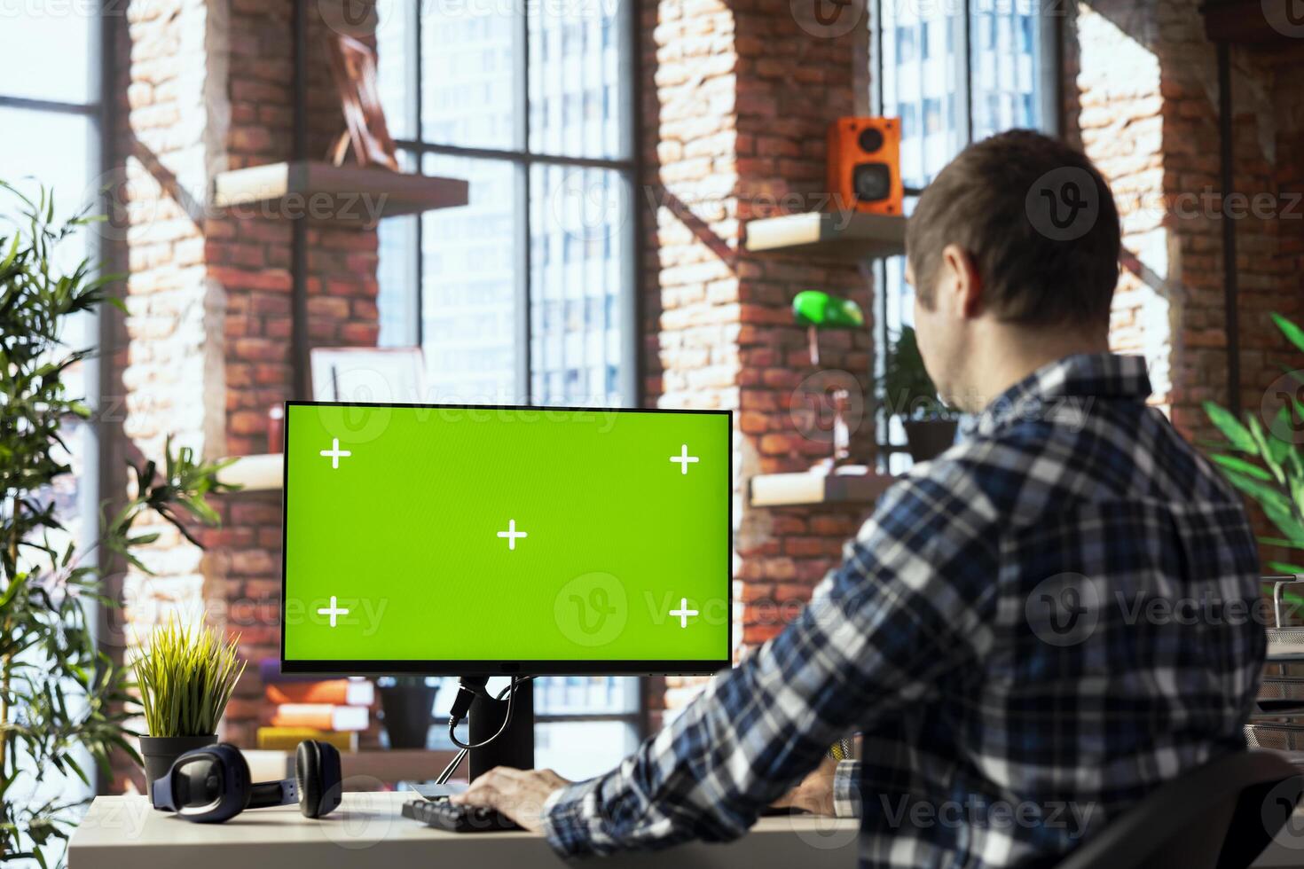 Freelancer in home office completing spreadsheets on mockup computer, entering data, calculating totals. Remotely working accountant analyzing figures on green screen PC, using spreadsheet software photo