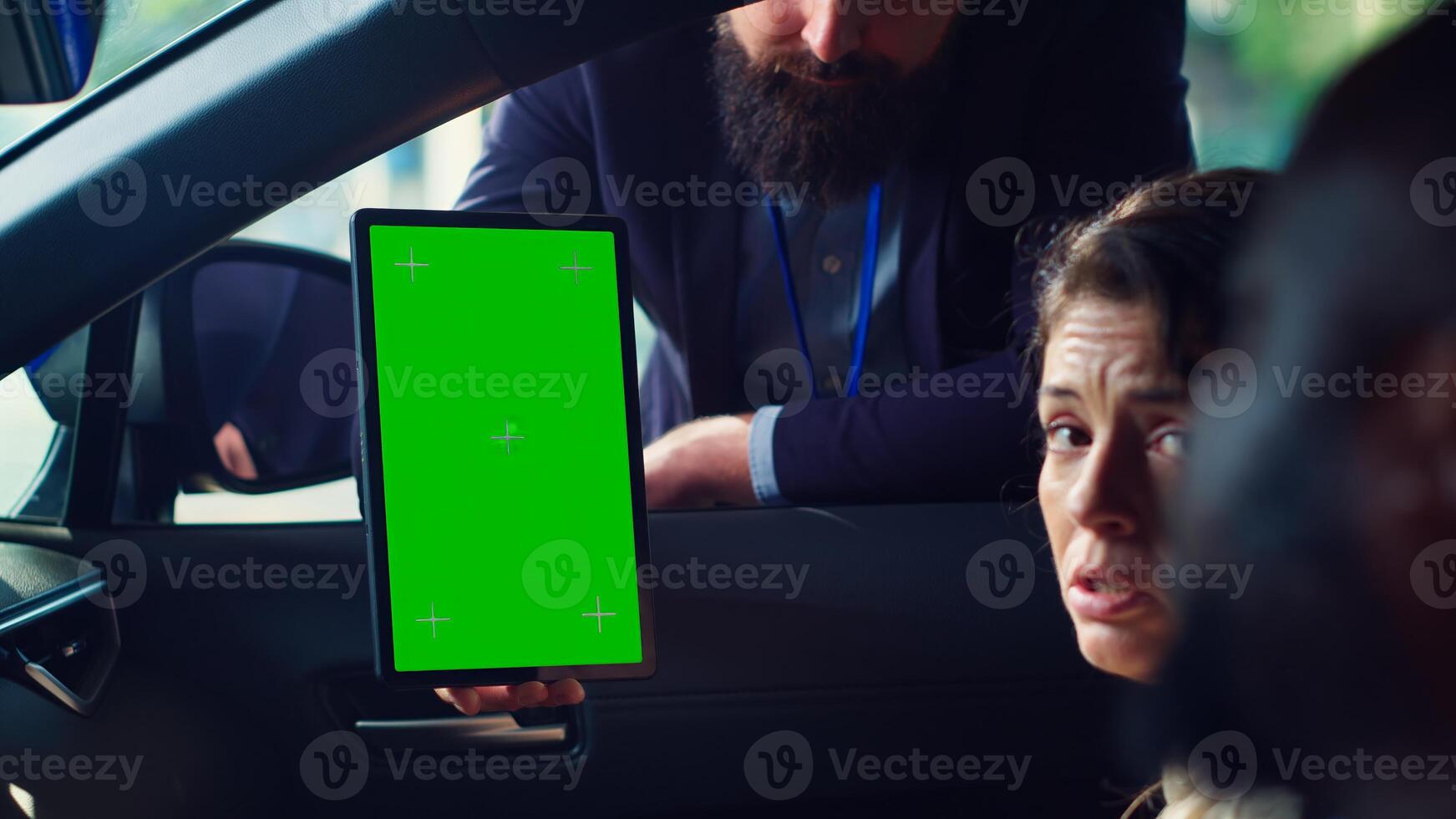 Salesman using green screen tablet to present car addons options to clients, after finishing test drive. Showroom agent mockup device to customers driving vehicle, camera A close up photo