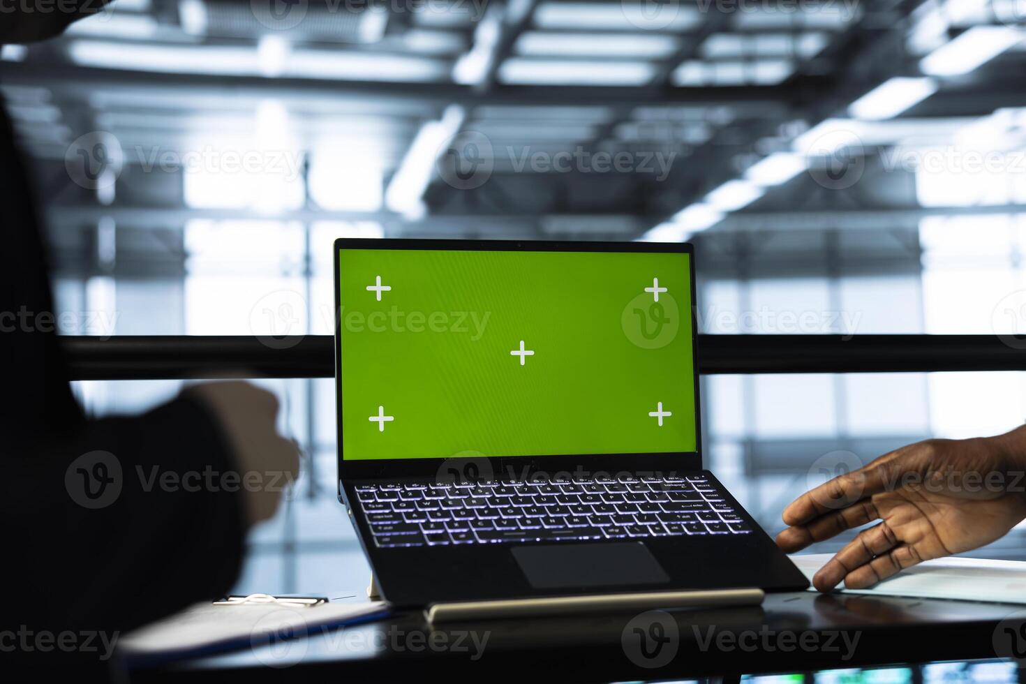 Programmers in data center using mockup laptop, inspecting server rigs, updating network topologies. Close up of IT coworkers brainstorming, using chroma key notebook, ensuring stable operations photo