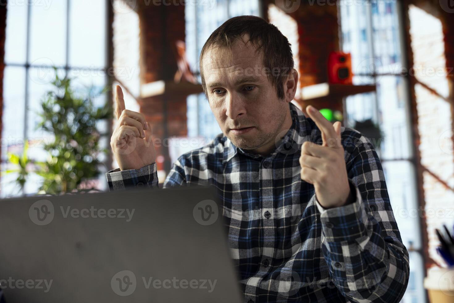 Teleworker in home office using laptop, preparing presentation slides, adjusting layouts. Freelancer finishing company project, writing summaries, saving files on notebook, uploading materials photo