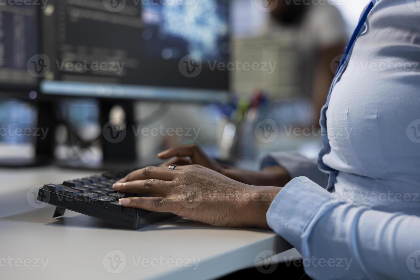 Engineer in data center typing on keyboard, optimizing IT infrastructure using network management skills. Close up of server room employee upgrading equipment, reducing operational costs photo