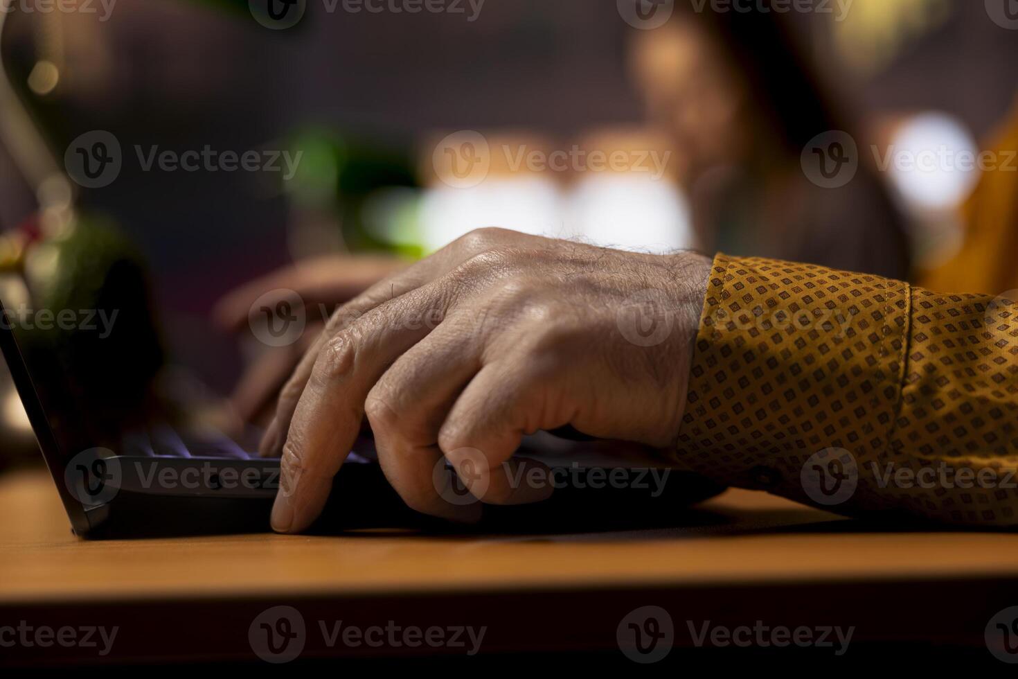 Elderly man pupil studying with web academic materials on laptop, collecting important information for exams and thesis completion. Old man serious about graduating college. Close up. photo