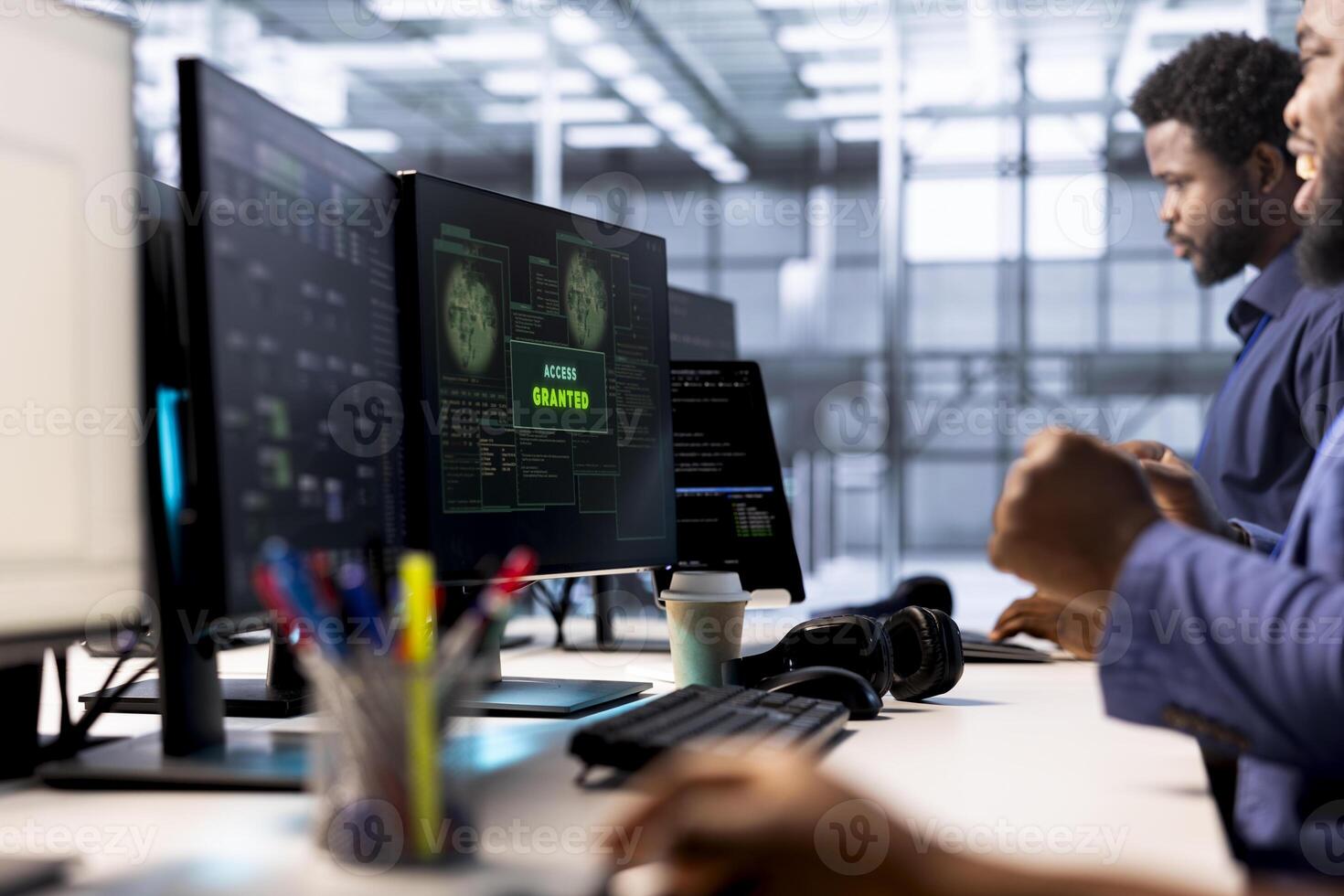 Developer receiving access granted notification while reconfiguring server farm, optimizing it. Worker ensures data center operates efficiently, happy after successfully eliminating all errors photo