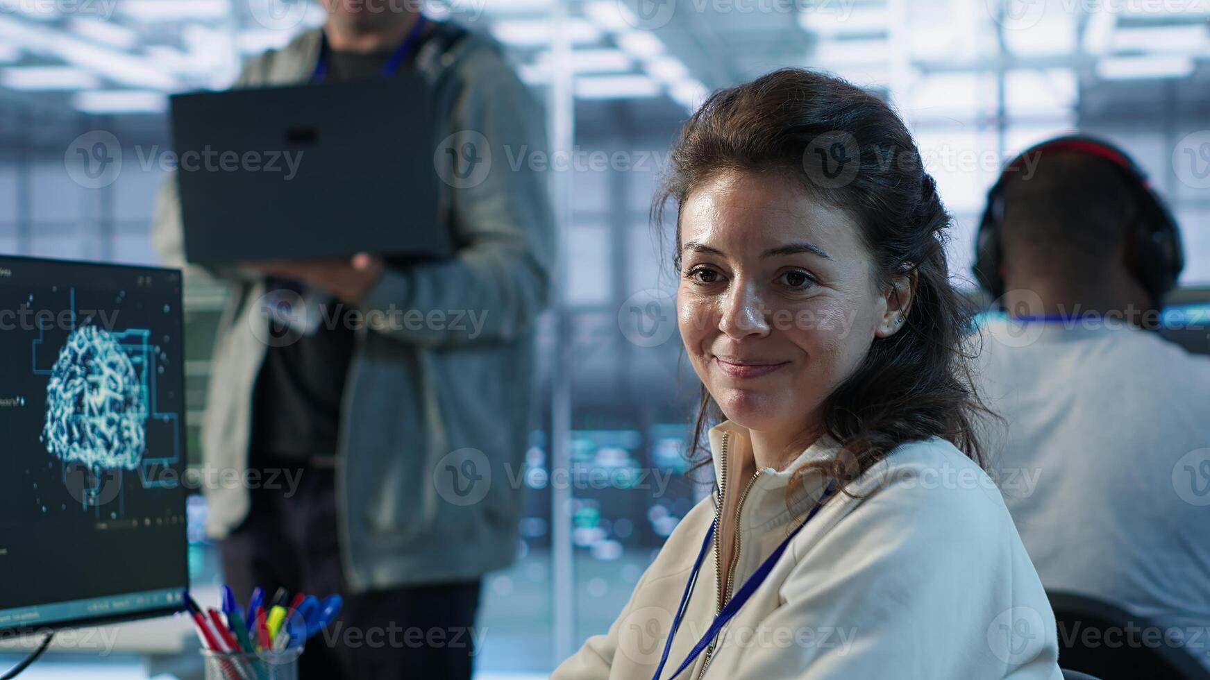 Portrait of upbeat woman working in high tech AI facility providing computing resources for different workloads. Joyous admin checking on artificial intelligence data center supercomputers, camera A photo