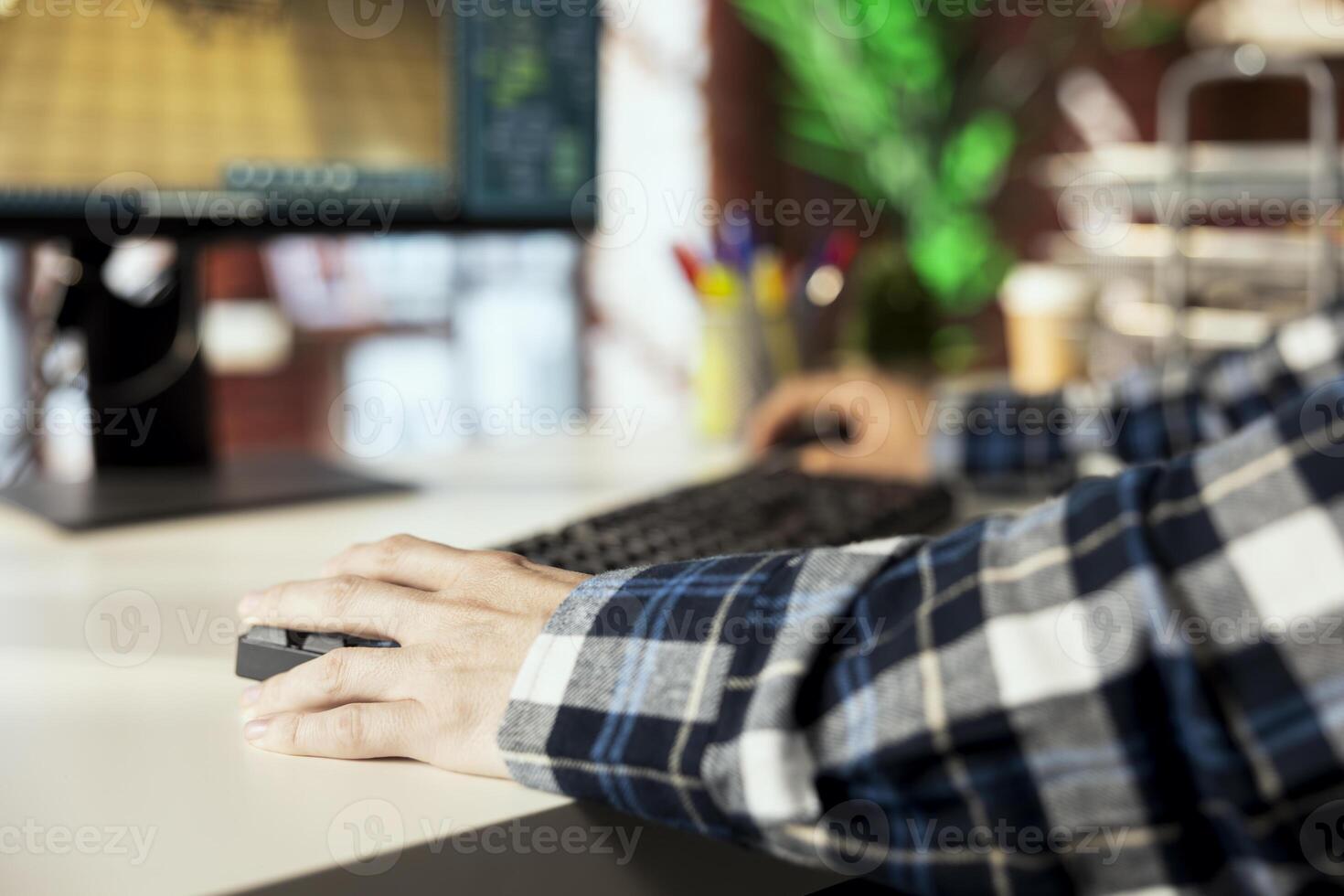 Interior designer at home using 3D modeling software on PC, moving furniture assets. Close up of architectural designer positioning items in room based on client requests photo