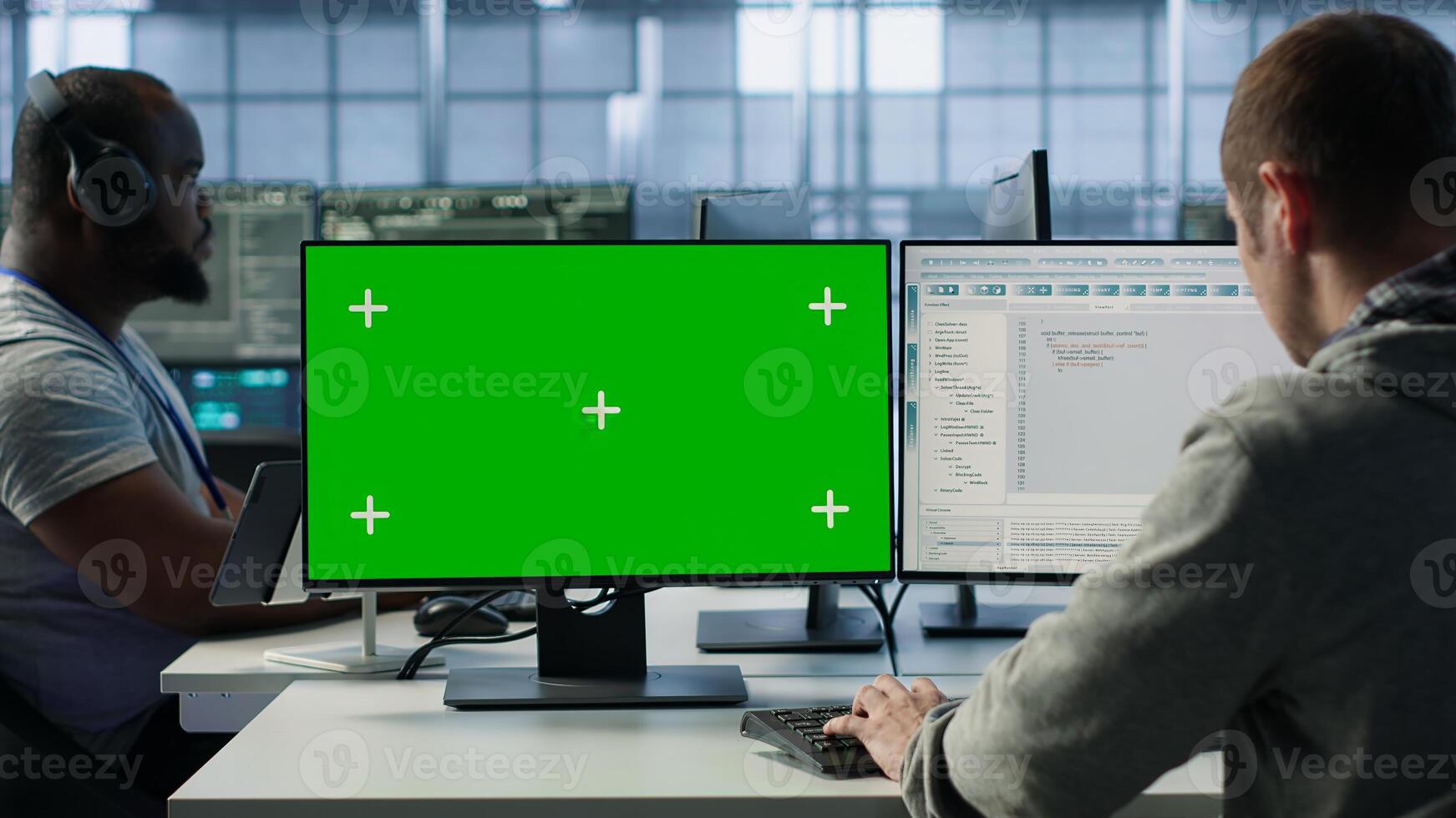 Engineer in server hub using green screen PC to repair equipment storing datasets. Professional using mockup computer to do debugging on rigs doing computational operations, camera A photo