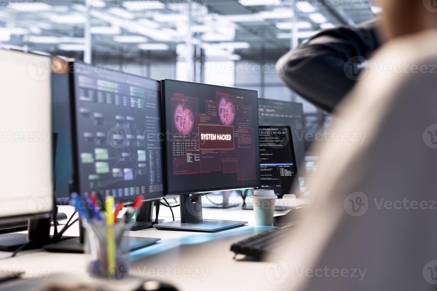 Server hub colleagues cooperating to protect hardware from hacker attack stealing info. Group of data center programmers trying to erase virus after seeing security breach alert on monitor photo